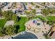 Aerial view of a playground set in lush landscaping amongst single-Gathering homes at 1310 S Vine Ct, Gilbert, AZ 85233