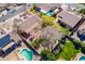 Aerial view of neighborhood featuring homes with tile roofs, pools and well-maintained yards at 1310 S Vine Ct, Gilbert, AZ 85233