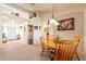 Inviting dining room with a view into other rooms and featuring a wooden dining set at 1310 S Vine Ct, Gilbert, AZ 85233