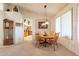 Cozy dining area with a round wooden table and natural light from the window at 1310 S Vine Ct, Gilbert, AZ 85233