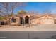 Attractive single-story home featuring a three-car garage and well-maintained landscaping at 1310 S Vine Ct, Gilbert, AZ 85233