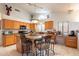 Stylish kitchen with granite countertops, a central island with seating, and modern appliances at 1310 S Vine Ct, Gilbert, AZ 85233