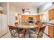 Beautiful kitchen with a central island, granite countertops, and ample cabinet space, perfect for cooking at 1310 S Vine Ct, Gilbert, AZ 85233