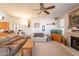 Comfortable living room with plush seating, a decorative fireplace, and an aquarium, bathed in natural light at 1310 S Vine Ct, Gilbert, AZ 85233