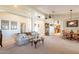 Spacious living room with an open concept design, seamlessly connecting to the kitchen and dining area at 1310 S Vine Ct, Gilbert, AZ 85233
