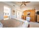 Serene bedroom with neutral tones and an archway to the main bathroom at 1310 S Vine Ct, Gilbert, AZ 85233