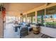 Covered patio with outdoor seating, tiled floor, and a decorative barrel at 1310 S Vine Ct, Gilbert, AZ 85233