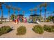 Community playground featuring slides, climbing structures, and a sand base at 1310 S Vine Ct, Gilbert, AZ 85233