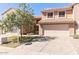 Inviting two-story home featuring a well-maintained front yard and a spacious two-car garage at 13820 S 41St Way, Phoenix, AZ 85044