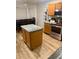 Well-lit kitchen with a dining table set and a center island at 13820 S 41St Way, Phoenix, AZ 85044