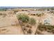 Desert home featuring an expansive fenced-in yard with a covered porch, desert landscaping, and privacy at 1600 W Ivar Rd, San Tan Valley, AZ 85144