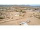 An inviting aerial perspective of a desert home featuring a generous lot and serene surroundings at 1600 W Ivar Rd, San Tan Valley, AZ 85144