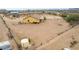 Aerial view of the property highlighting the expansive desert landscape and home's exterior at 1600 W Ivar Rd, San Tan Valley, AZ 85144