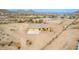Desert home featuring attached two-car garage with expansive fenced-in yard, concrete driveway, and desert landscaping at 1600 W Ivar Rd, San Tan Valley, AZ 85144