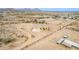 Aerial view capturing a well-kept desert home, boasting a spacious lot and a charming neighborhood at 1600 W Ivar Rd, San Tan Valley, AZ 85144