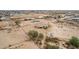 Expansive aerial image of a desert home, highlighting its spacious lot and proximity to local amenities at 1600 W Ivar Rd, San Tan Valley, AZ 85144