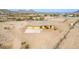 Desert home featuring attached two-car garage with expansive fenced-in yard and desert landscaping in a rural setting at 1600 W Ivar Rd, San Tan Valley, AZ 85144