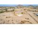 Desert home featuring attached two-car garage with expansive fenced-in yard, concrete driveway, and desert landscaping at 1600 W Ivar Rd, San Tan Valley, AZ 85144