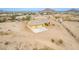 Desert home featuring attached two-car garage with expansive fenced-in yard, concrete driveway, and desert landscaping at 1600 W Ivar Rd, San Tan Valley, AZ 85144