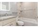 Bathroom with a single sink vanity, granite countertop, tub and shower, and modern lighting fixture at 1600 W Ivar Rd, San Tan Valley, AZ 85144