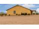 Exterior rear elevation of home with desert landscaping at 1600 W Ivar Rd, San Tan Valley, AZ 85144