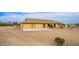 Exterior of the home with desert landscaping and a three-car garage at 1600 W Ivar Rd, San Tan Valley, AZ 85144