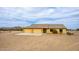 Exterior featuring a three-car garage, desert landscaping, and mountain views at 1600 W Ivar Rd, San Tan Valley, AZ 85144
