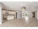 Open-concept living space seamlessly integrates the kitchen with hardwood floors at 1600 W Ivar Rd, San Tan Valley, AZ 85144