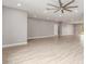 Spacious living room with hardwood floors and neutral paint, ideal for entertaining at 1600 W Ivar Rd, San Tan Valley, AZ 85144