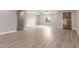 Bright living room showcasing hardwood floors, fresh paint, and a cozy ambiance at 1600 W Ivar Rd, San Tan Valley, AZ 85144