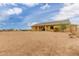 Spacious lot with desert landscaping surrounding the rear exterior at 1600 W Ivar Rd, San Tan Valley, AZ 85144