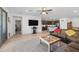 Open-concept living room flowing into the kitchen and dining area, great for entertaining at 19856 W Monterosa St, Litchfield Park, AZ 85340