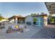 An outdoor fire pit, a BBQ, and sliding glass doors define this private backyard entertainment space at 2106 W Shawnee Dr, Chandler, AZ 85224