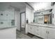 Bathroom featuring a glass shower, double sink vanity with granite countertops at 2106 W Shawnee Dr, Chandler, AZ 85224