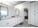 Elegant bathroom with double sinks, mosaic tile backsplash, and ample storage in white cabinetry at 2106 W Shawnee Dr, Chandler, AZ 85224