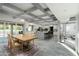 Bright and airy dining area with a wooden table set, overlooking the spacious kitchen and outdoor patio at 2106 W Shawnee Dr, Chandler, AZ 85224