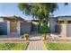 A brick walkway bordered with decorative plants leads to the front door of this stylishly landscaped home at 2106 W Shawnee Dr, Chandler, AZ 85224