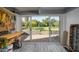 Finished garage with a workspace table and large sliding glass doors opening to the backyard at 2106 W Shawnee Dr, Chandler, AZ 85224