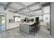 Spacious kitchen featuring a large island with seating, white cabinets, and modern stainless steel appliances at 2106 W Shawnee Dr, Chandler, AZ 85224