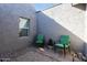 Private outdoor patio with comfortable green chairs, offering a tranquil space for relaxation at 2106 W Shawnee Dr, Chandler, AZ 85224