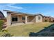 Well-maintained backyard with a covered patio and lush green grass for outdoor enjoyment at 22443 E Munoz St, Queen Creek, AZ 85142
