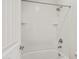 Clean, white bathroom featuring a shower and tub with a tiled surround at 22443 E Munoz St, Queen Creek, AZ 85142