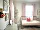 Charming bedroom featuring soft decor, a cozy bed, and tasteful wall art at 22443 E Munoz St, Queen Creek, AZ 85142