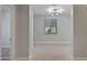 Well-lit bedroom featuring neutral walls, carpeted floor, and a modern chandelier at 22443 E Munoz St, Queen Creek, AZ 85142