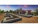 Community garden plots, with manicured trees, and open skies; a community space for residents to grow at 22443 E Munoz St, Queen Creek, AZ 85142