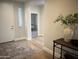 Welcoming entryway with a decorative rug and table, leading into a brightly lit interior at 22443 E Munoz St, Queen Creek, AZ 85142