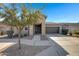 Charming single-story home featuring a two car garage, landscaped front yard, and neutral color palette at 22443 E Munoz St, Queen Creek, AZ 85142