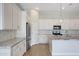 Modern kitchen features granite countertops, stainless steel appliances, and white cabinetry at 22443 E Munoz St, Queen Creek, AZ 85142
