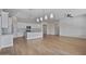 Open floorplan featuring stainless steel appliances, an island, granite countertops, and neutral colors at 22443 E Munoz St, Queen Creek, AZ 85142