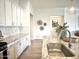 Granite countertops and marble backsplash adorn this kitchen with stainless steel sink and modern pendant lighting at 22443 E Munoz St, Queen Creek, AZ 85142